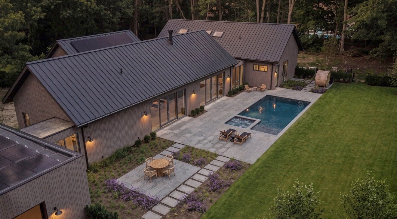 The house, terrace and pool seen from above the garden