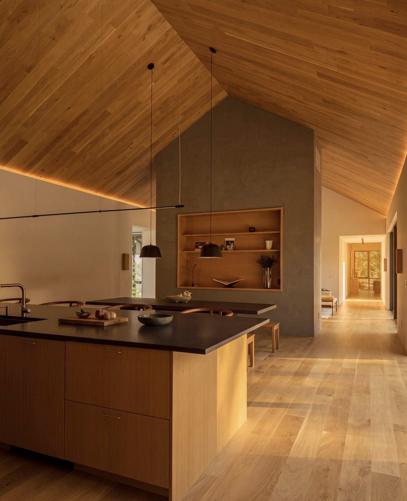 The kitchen island under the vault, a plaster chimney and open shelves