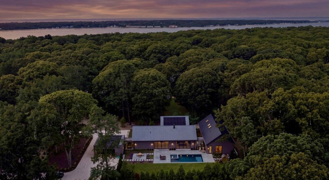 6 Great Circle from the air at dusk, the woodland and the bay beyond